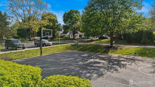 16 Exeter Pass, Colts Neck, NJ 07722 - view of basketball court with community basketball court and a lawn