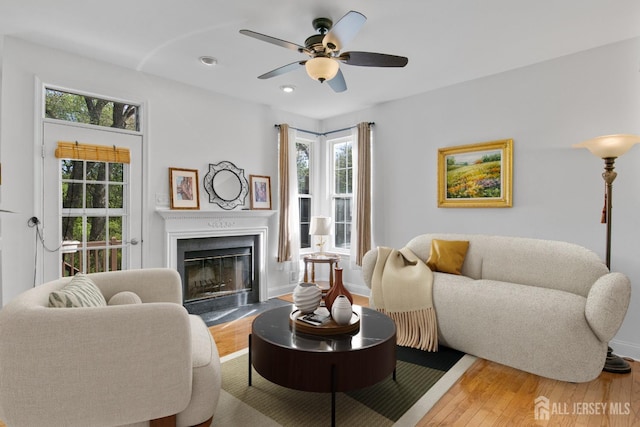 16 Exeter Pass, Colts Neck, NJ 07722 - living room featuring wood finished floors, a fireplace with flush hearth, ceiling fan, recessed lighting, and baseboards