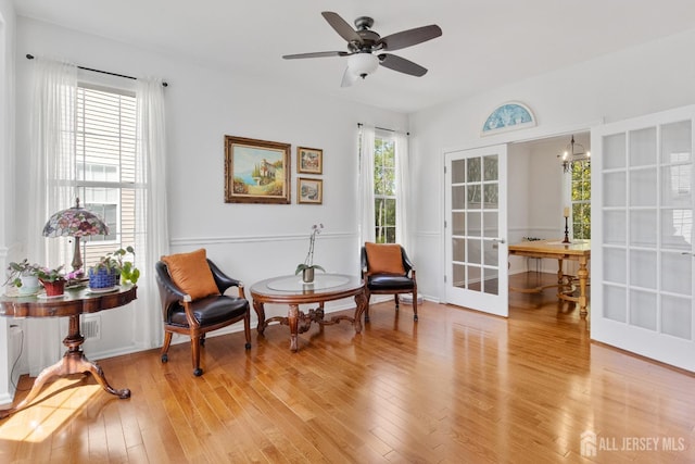 16 Exeter Pass, Colts Neck, NJ 07722 - sitting room with french doors, light wood-style floors, and a ceiling fan
