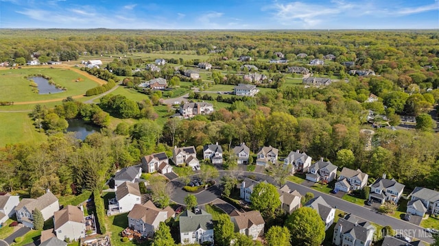 16 Exeter Pass, Colts Neck, NJ 07722 - aerial overview of property's location featuring nearby suburban area, a forest, and a nearby body of water