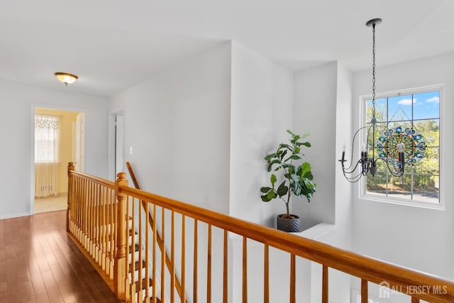 16 Exeter Pass, Colts Neck, NJ 07722 - hallway with an upstairs landing, hardwood / wood-style flooring, and a chandelier