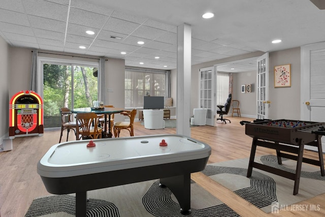 16 Exeter Pass, Colts Neck, NJ 07722 - rec room with french doors, wood finished floors, and a paneled ceiling