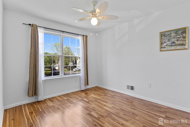 16 Exeter Pass, Colts Neck, NJ 07722 - unfurnished room featuring light wood-style flooring, ceiling fan, and baseboards