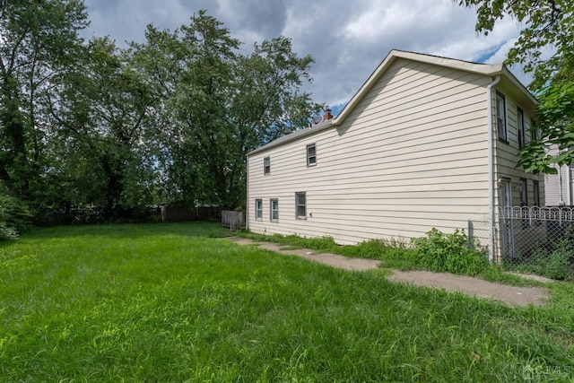 view of property exterior featuring a yard