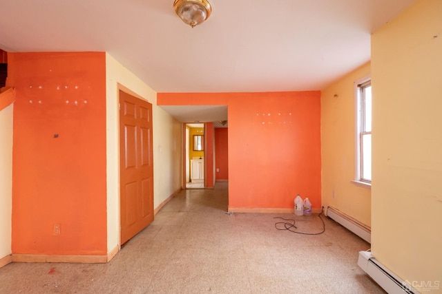 empty room with a baseboard heating unit