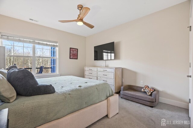 carpeted bedroom featuring ceiling fan