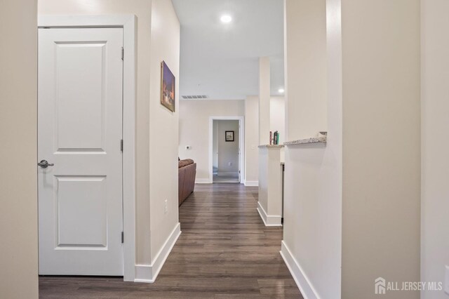 hall featuring dark wood-type flooring