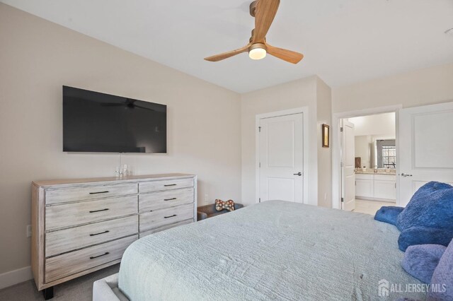 bedroom with ceiling fan and ensuite bathroom