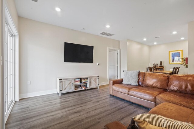 living room with dark hardwood / wood-style floors