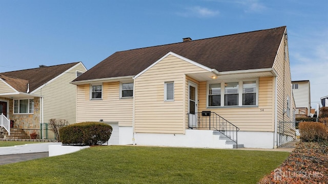 view of front of house featuring a shingled roof, a chimney, and a front lawn