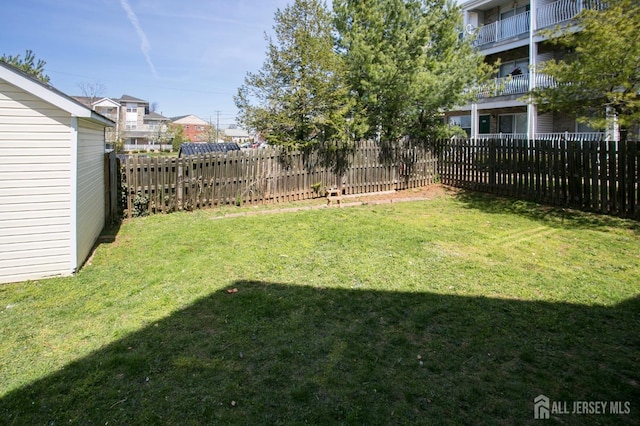 view of yard with a fenced backyard