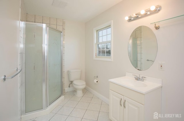 full bathroom featuring tile patterned floors, toilet, a shower stall, baseboards, and vanity