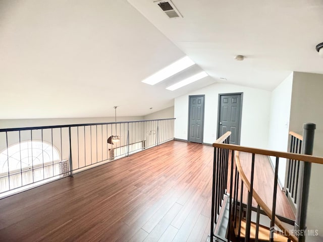832 Edpas Rd, New Brunswick, NJ 08901 - additional living space featuring vaulted ceiling, a skylight, and wood finished floors