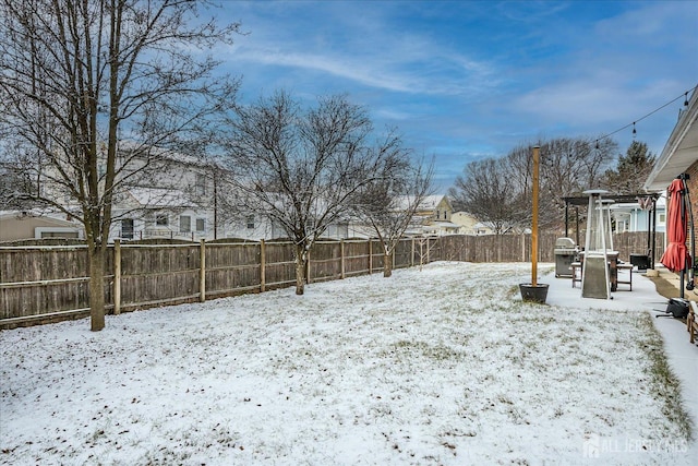 view of yard covered in snow