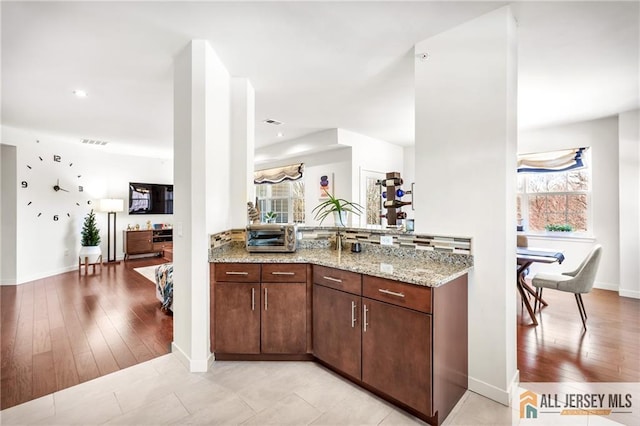 448 Tower Blvd Unit 448, Piscataway, NJ 08854 - kitchen featuring light stone countertops, baseboards, light wood finished floors, and recessed lighting