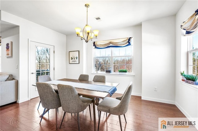 448 Tower Blvd Unit 448, Piscataway, NJ 08854 - dining room with hardwood / wood-style flooring, a chandelier, and baseboards