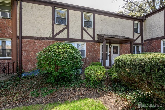245 Newman St, Metuchen, NJ 08840 - rear view of property with stucco siding and cooling unit