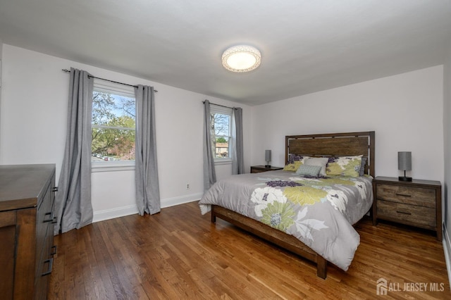 245 Newman St, Metuchen, NJ 08840 - bedroom with wood finished floors, baseboards, and multiple windows