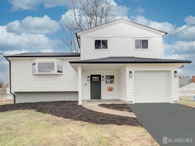 view of front of home featuring a garage and covered porch