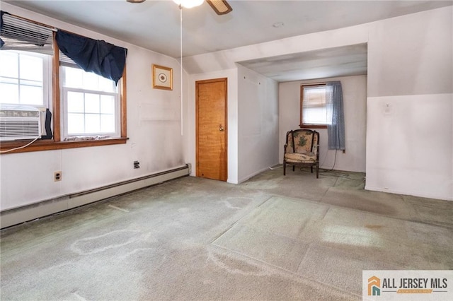 unfurnished bedroom featuring ceiling fan, carpet floors, baseboard heating, and cooling unit