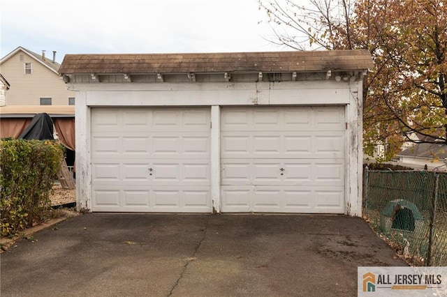 detached garage with fence