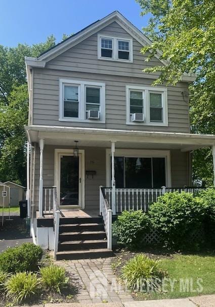 75 Douglas St, Fords, NJ 08863 - american foursquare style home featuring a porch and cooling unit
