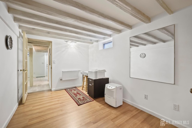 365 E John St, South Amboy, NJ 08879 - basement featuring wood finished floors, baseboards, and radiator