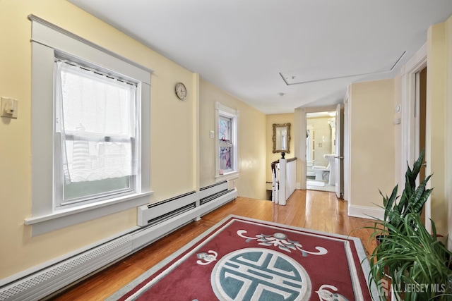 365 E John St, South Amboy, NJ 08879 - hall featuring wood finished floors, a baseboard radiator, and attic access