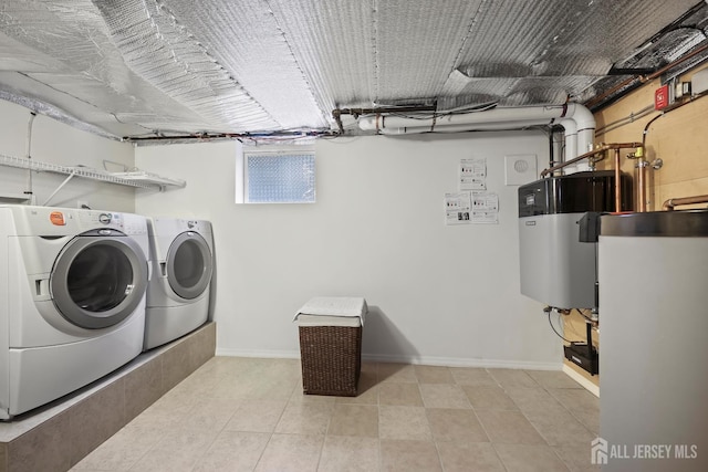 365 E John St, South Amboy, NJ 08879 - laundry room featuring washing machine and clothes dryer, heat pump water heater, baseboards, water heater, and light tile patterned flooring