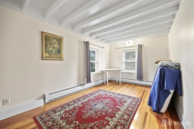 365 E John St, South Amboy, NJ 08879 - sitting room featuring beam ceiling, baseboard heating, wood finished floors, and a baseboard radiator