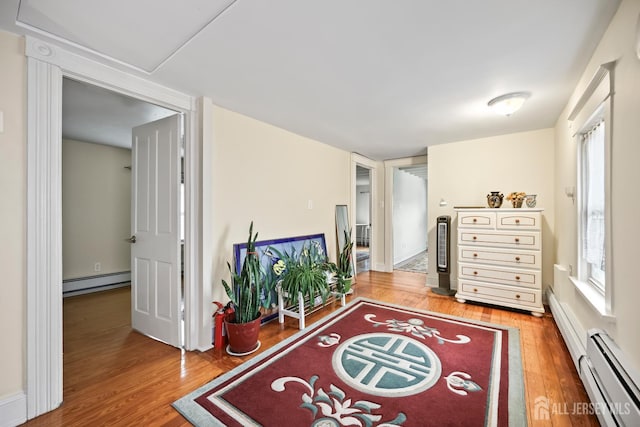 365 E John St, South Amboy, NJ 08879 - sitting room with baseboard heating and wood finished floors