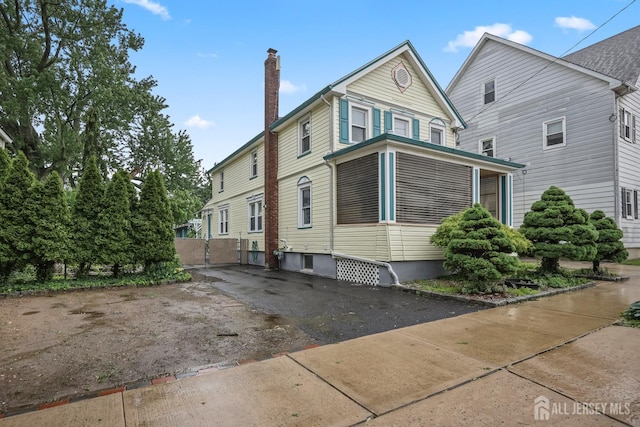 365 E John St, South Amboy, NJ 08879 - view of side of property with a chimney