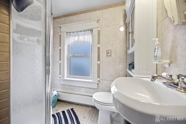 365 E John St, South Amboy, NJ 08879 - bathroom with a baseboard radiator, a sink, toilet, tile walls, and a shower stall