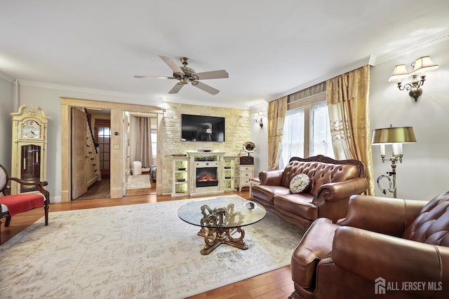 365 E John St, South Amboy, NJ 08879 - living room featuring ornamental molding, a ceiling fan, wood finished floors, and a glass covered fireplace
