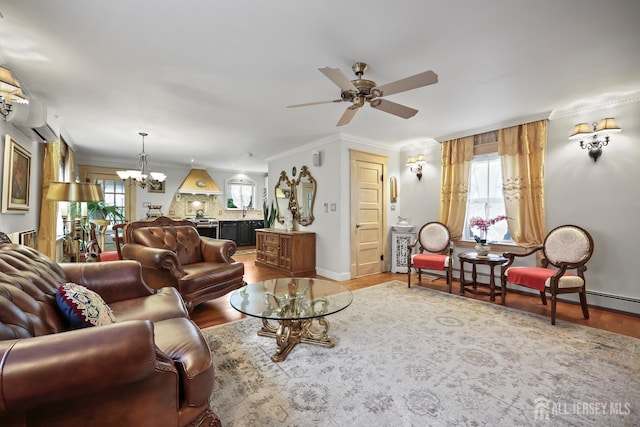 365 E John St, South Amboy, NJ 08879 - living area with a chandelier, a ceiling fan, wood finished floors, ornamental molding, and baseboards