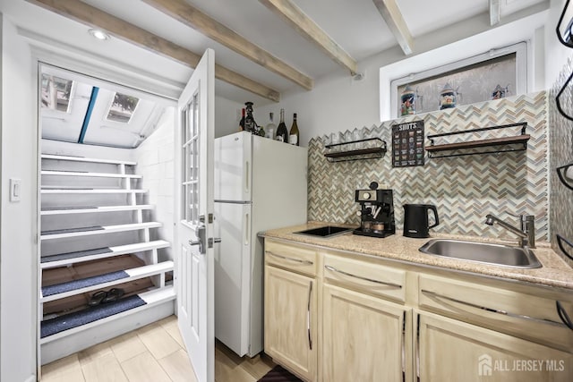 365 E John St, South Amboy, NJ 08879 - kitchen with freestanding refrigerator, a sink, decorative backsplash, beam ceiling, and light brown cabinetry