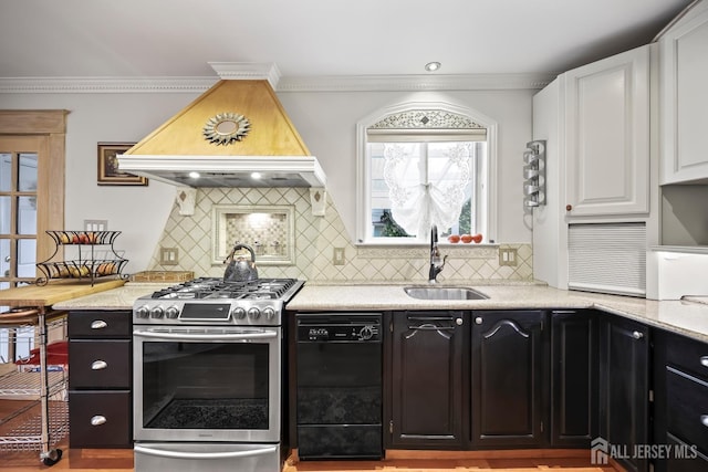 365 E John St, South Amboy, NJ 08879 - kitchen with stainless steel range with gas stovetop, black dishwasher, a sink, custom exhaust hood, and white cabinets
