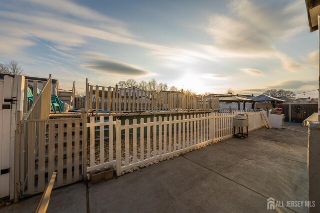 patio terrace at dusk with a gazebo