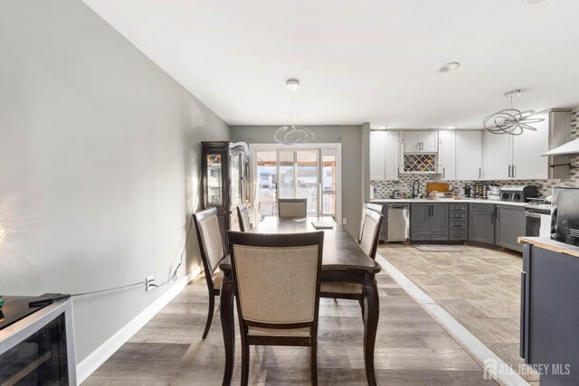 dining room featuring wood-type flooring and sink