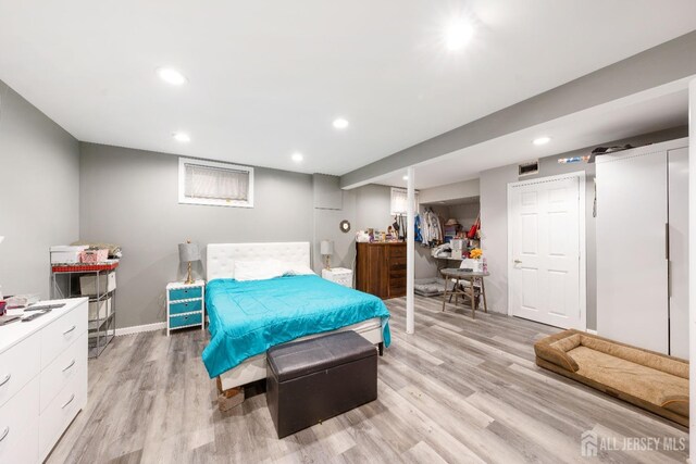 bedroom with light hardwood / wood-style flooring