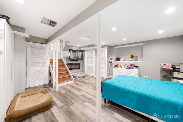 bedroom with light wood-type flooring