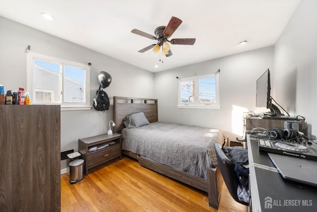 bedroom featuring ceiling fan and light hardwood / wood-style floors