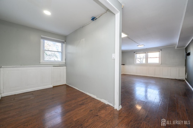 interior space with a healthy amount of sunlight and dark hardwood / wood-style flooring