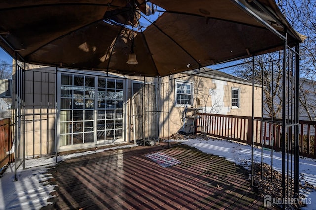 view of snow covered deck