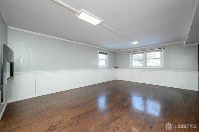 unfurnished room with crown molding and dark wood-type flooring