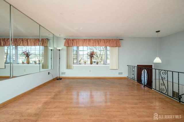 spare room featuring hardwood / wood-style flooring