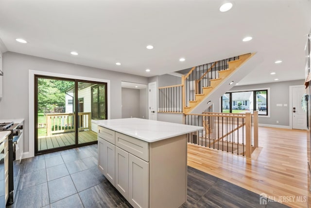 13 Lauretta Dr, East Brunswick, NJ 08816 - kitchen with recessed lighting, stove, a kitchen island, and light stone countertops