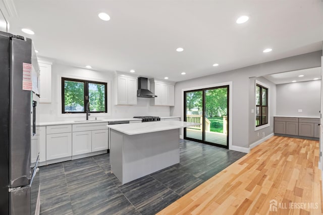 13 Lauretta Dr, East Brunswick, NJ 08816 - kitchen featuring freestanding refrigerator, wall chimney exhaust hood, light countertops, white cabinets, and recessed lighting