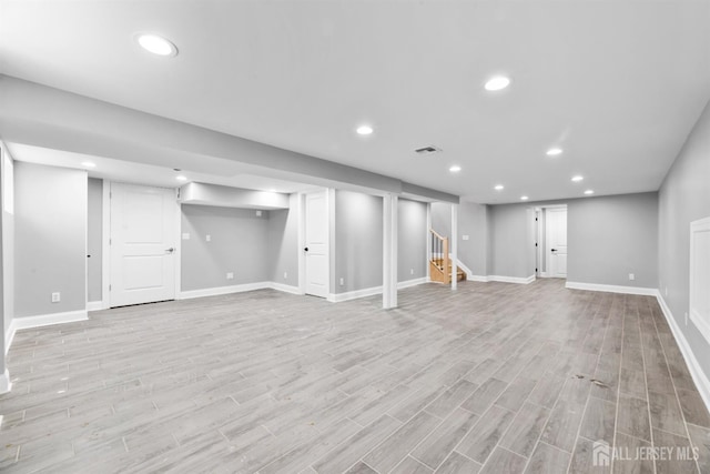 13 Lauretta Dr, East Brunswick, NJ 08816 - finished below grade area with light wood-type flooring, stairs, and recessed lighting
