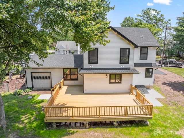 13 Lauretta Dr, East Brunswick, NJ 08816 - view of front facade with a shingled roof, a wooden deck, and a front yard